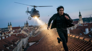 Ultra-realistic cinematic shot of a lone secret agent sprinting across connected rooftops in a European old town.
Wind whipping his jacket as he leaps between buildings.
A helicopter hovers low behind him, its spotlight cutting through drifting dust.
Camera angle: low-angle chase shot.
Mood: high-stakes, relentless pursuit.